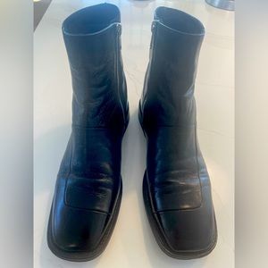 Black leather ankle boots. Flat.